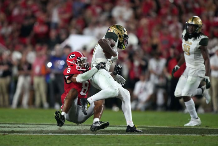 Sep 23, 2023; Athens, Georgia, USA; Georgia Bulldogs defensive back Joenel Aguero (8) tackles UAB Blazers receiver Amere Thomas (17) in the second half at Sanford Stadium.